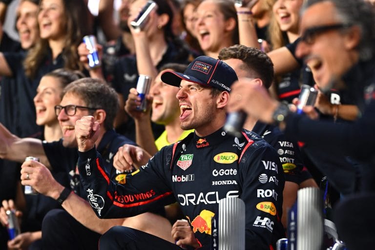Max Verstappen celebrating Qatar GP victory as Helmut Marko watches from Red Bull garage