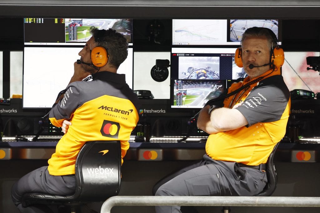 Zak Brown McLaren CEO discusses team strategy with Andrea Stella